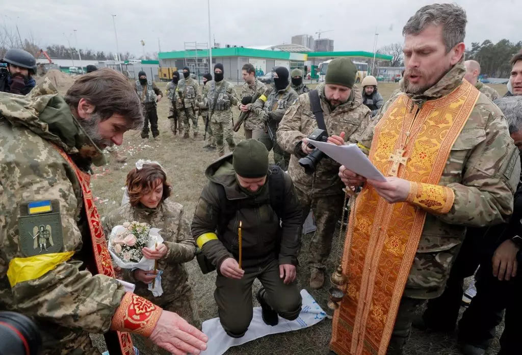 Ukrainian territorial defense fighters tie the knot amid Russian military operation