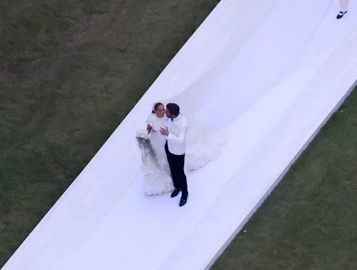 *PREMIUM-EXCLUSIVE* Jennifer Lopez marries Ben Affleck (again!) wearing a stunning white wedding dress with a 20ft train