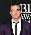 Robbie Williams vrea să-şi facă liposucţie