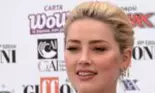 Amber Heard face exerciții de fitness cu fetița ei în brațe