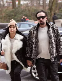 Nicolas Cage and his girlfriend matching black leather pants while going insid THE American Museum of Natural History