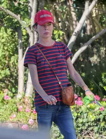 *EXCLUSIVE* Thin and frail Lara Flynn Boyle enjoys a cigarette while out with her dog