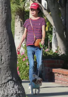 *EXCLUSIVE* Thin and frail Lara Flynn Boyle enjoys a cigarette while out with her dog