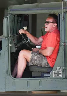 *EXCLUSIVE* Arnold Schwarzenegger running errands with his army jeep