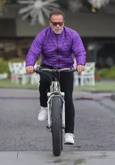 *EXCLUSIVE* Arnold Schwarzenegger goes for his daily bike ride with a buddy