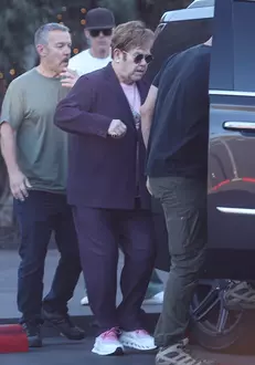 *EXCLUSIVE* Elton John Looks Frail as Hes Assisted to Car After Shopping at Maxfield in Los Angeles, CA