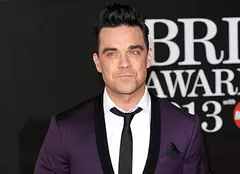 Robbie Williams învaţă cum să fie părinte