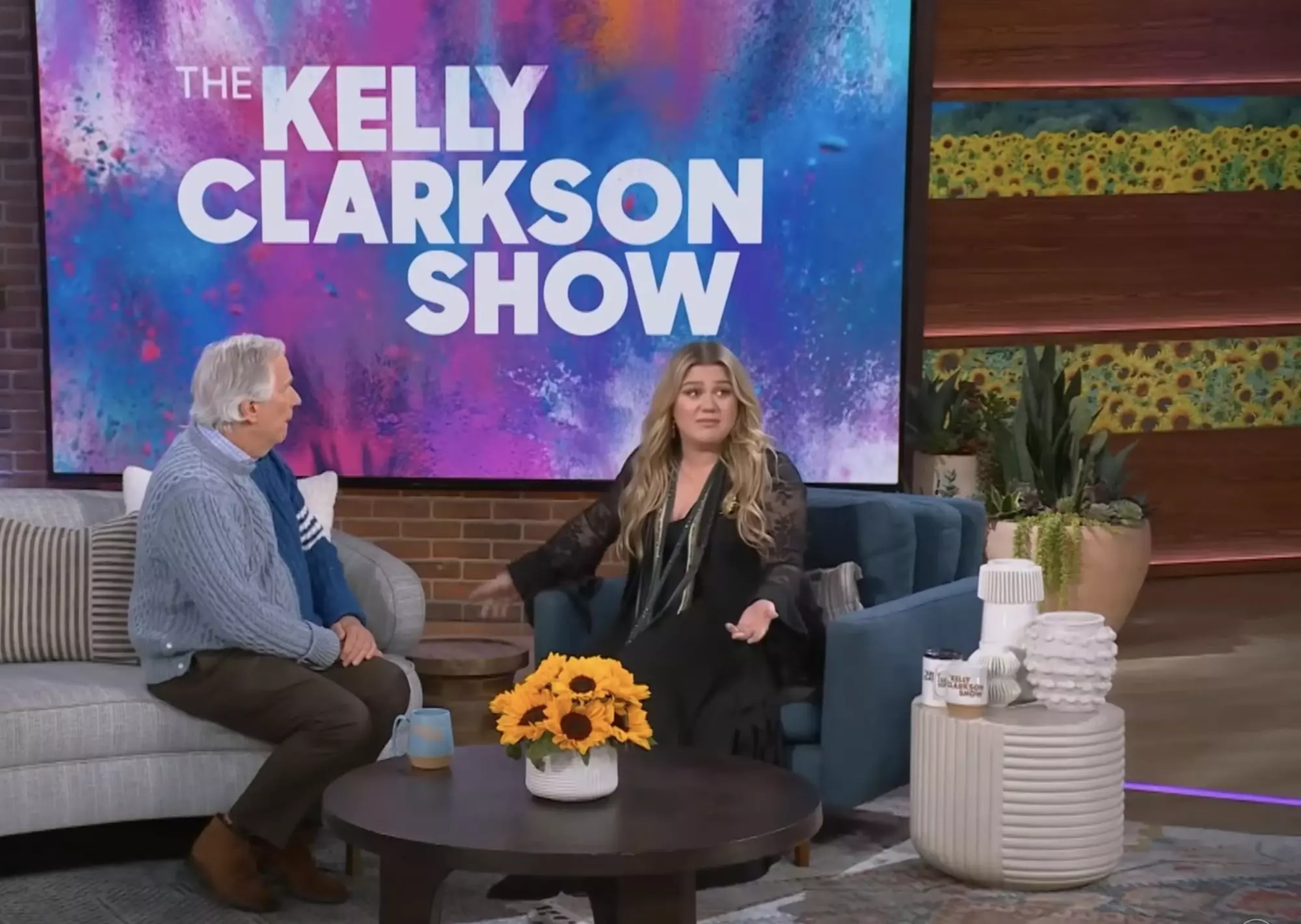 Kelly Clarkson wipes away tears as guest Henry Winkler offers advice to her daughter River who has been bullied for her dyslexia
