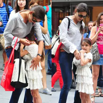 Poze: Katie Holmes şi micuţa Suri urmărite mereu de paparazzi