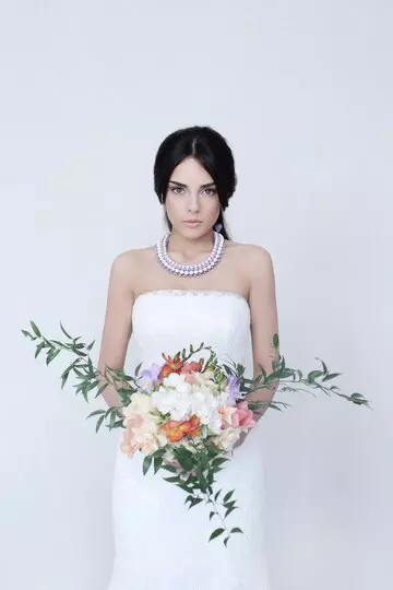 beautiful-bride-woman-wedding-dress-holding-bouquet-flowers_144627-33202