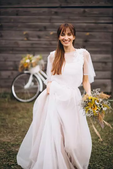 woman-white-dress-with-bicycle-by-wooden-wall_1303-9705