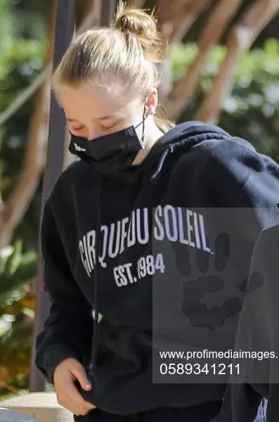 Angelina Jolie striking in black at the mall with Sholoh