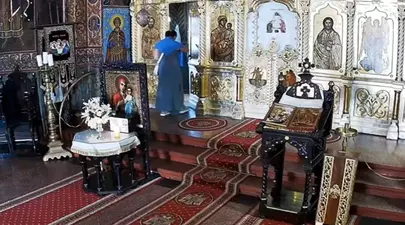 Ucraineancă, prinsă în timp ce fura dintr-o Biserică din București. Câți bani a reușit să sustragă femeia