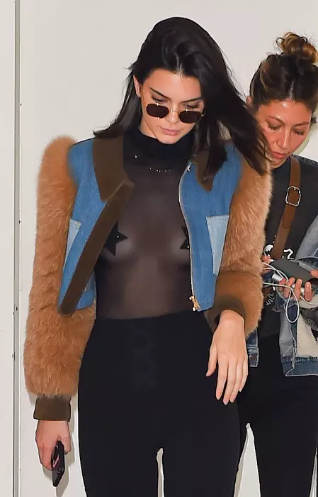 Kendall Jenner is seen with Star shape nipple covers in a black shear top in Paris