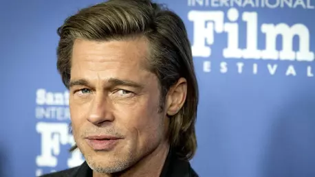 Brad Pitt, surprins în compania unei femei celebre la un concert Bono