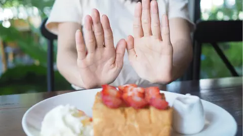 "Am slăbit 64 de kilograme fără să renunț la alimentele mele preferate"