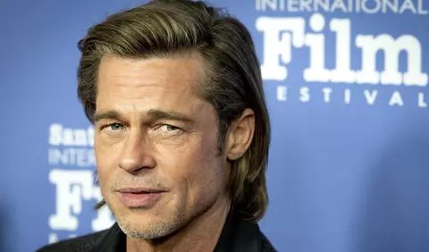 Brad Pitt, surprins în compania unei femei celebre la un concert Bono