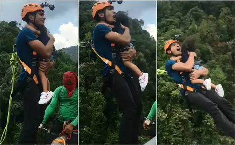 A sarit cu coarda de la inaltime cu copilul de 2 ani in brate