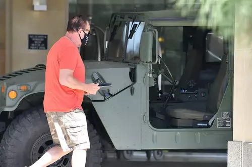 *EXCLUSIVE* Arnold Schwarzenegger running errands with his army jeep