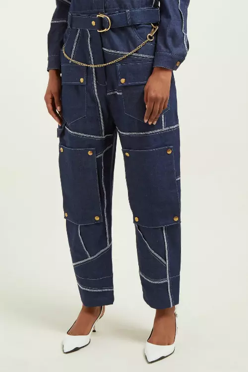Jeanși din bumbac cu aplicații metalice, Symonds Pearman, 335 euro, www.matchesfashion.com