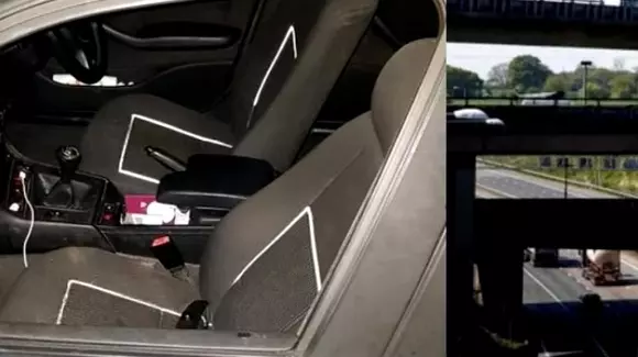 O femeie a căzut din maşină pe autostradă, după ce a ieşit pe geam să filmeze un clip