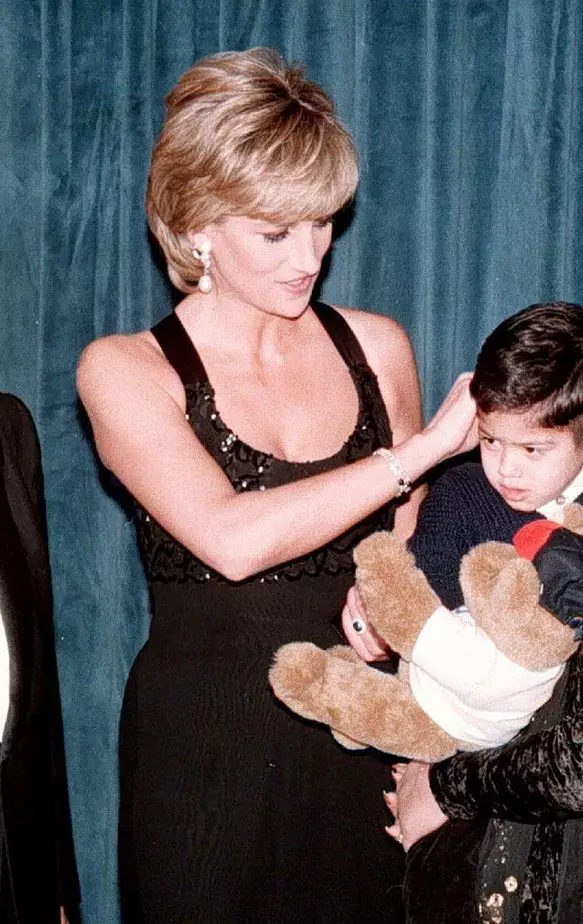 File photo dated 12/12/95 of the Princess of Wales meeting four-year-old Christopher Baretto and his mother Mariela before the Cerebral Palsy dinner in New York with (left) Dr Henry Kissinger and (right) General Colin Powell. Colin Powell, the former US J