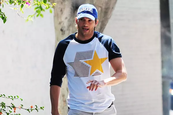 Mila Kunis and Ashton Kutcher take Mila's Baby Bump dressed in Dodgers blue to L.A. Dodgers Baseball Game