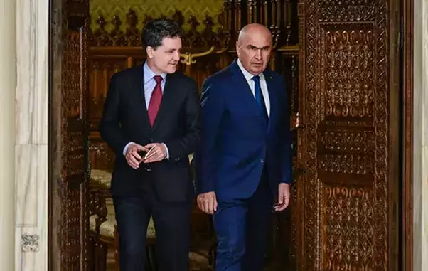 nicusor-dan-ilie-bolojan-afp20250620636g8zqv1highresromaniapoliticsgovernment-copy