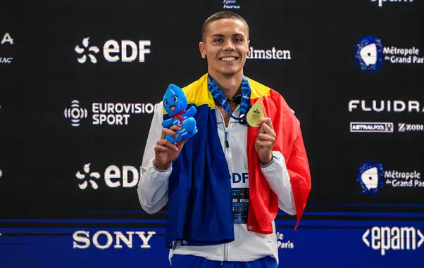 David Popovici of Romania celebrates after winning the gold