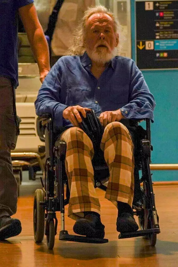 Nick Nolte arrives at the airport in a wheelchair ahead of the 83rd Venice International Film Festival