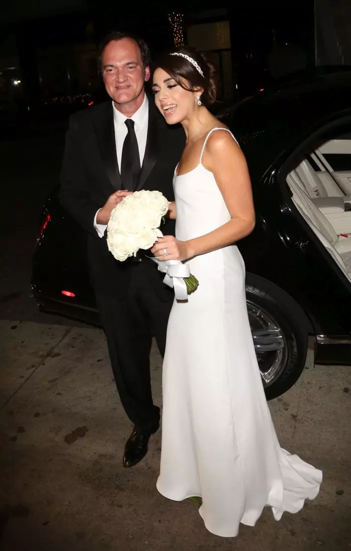 new wife head to their wedding reception