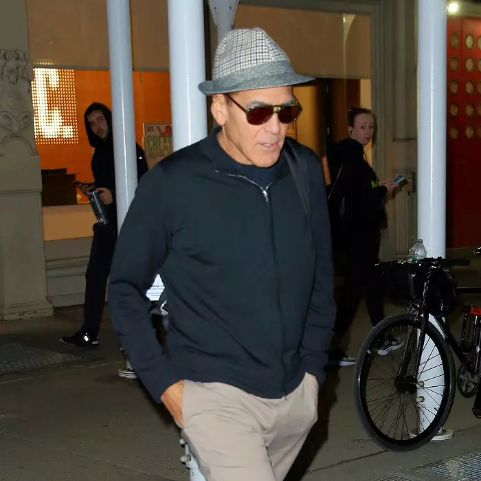 George Clooney cuts a youthful figure in a fedora after rehearsal for 'Good Night and Good Luck' in New York City