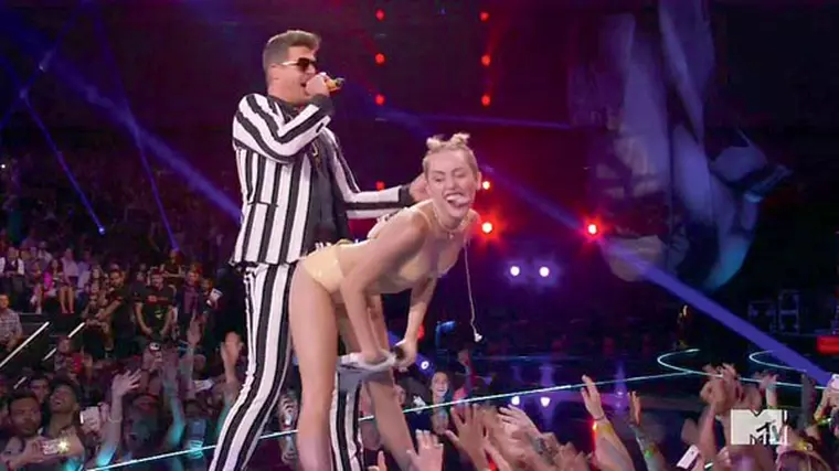 Miley Cyrus stuns MTV crowd with raunchy performance as she grinds up again singer Robin Thicke