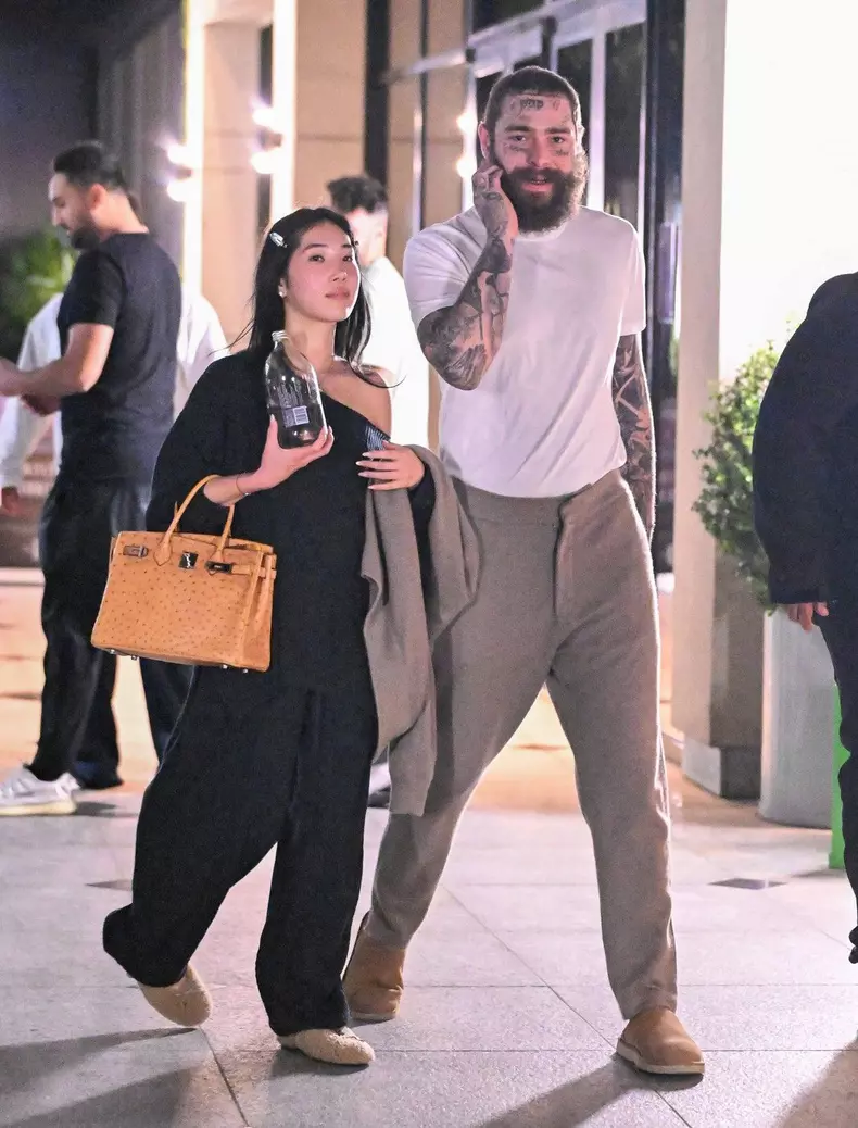 EXCLUSIVE: Post Malone and his girlfriend Christy Lee step out for a date night at high end movie theater iPic in WestWood, CA
