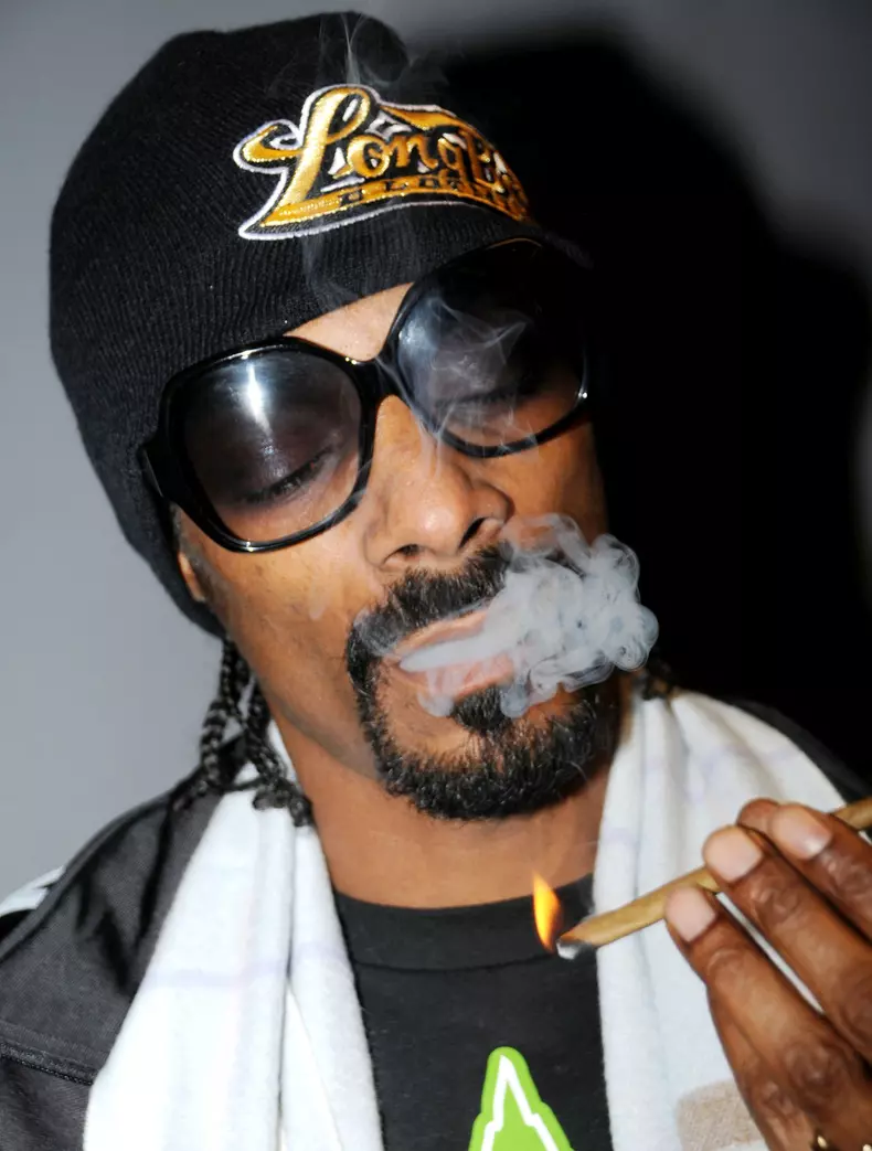 WHAT' S THAT YOUR SMOKING SNOOP? Rapper Snoop Dogg is spotted smoking a suspicious looking cigarette backstage at the Nokia Theatre in Los Angeles