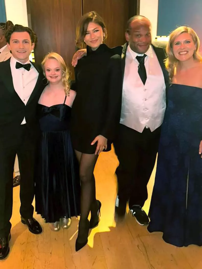 Tom Holland and Zendaya pose with guests at The Brothers Trust Posh Pub Quiz.