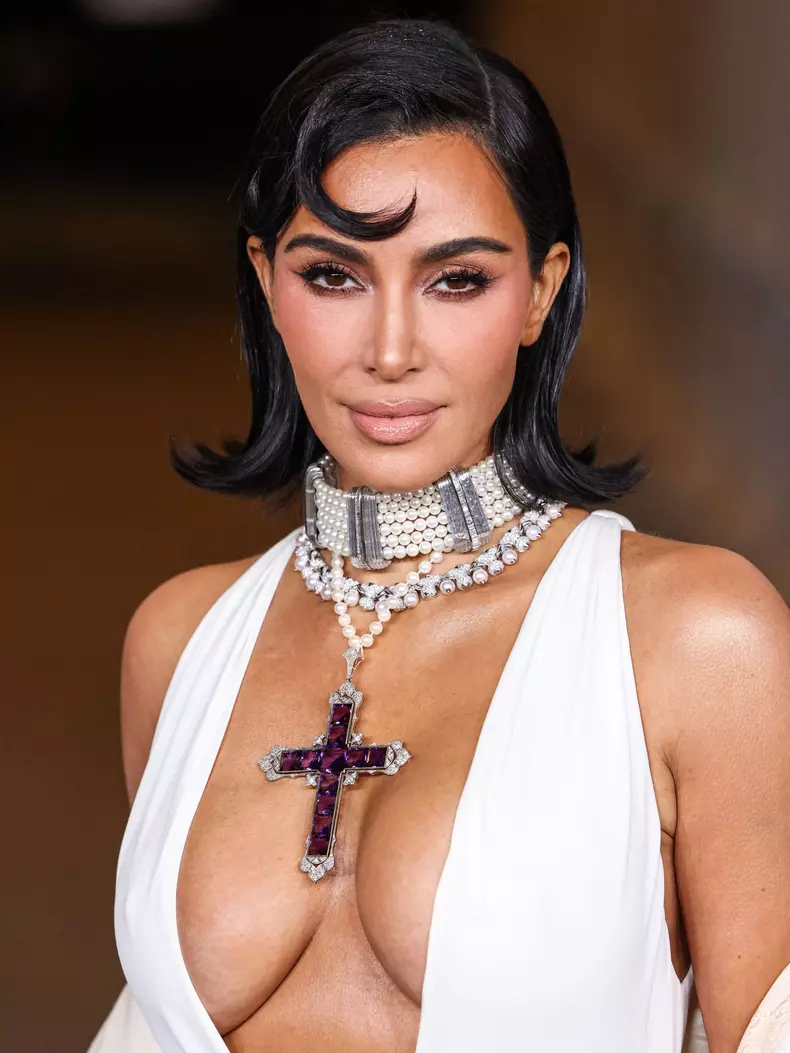 Kim Kardashian wearing a custom Gucci dress and coat with a Tallarico pearl choker, Bvlgari pearl and diamond necklace, and Princess Diana’s amethyst cross arrives at the 13th Annual LACMA Art + Film Gala 2024