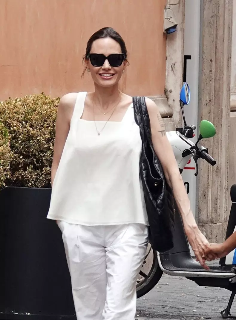 *EXCLUSIVE* WEB MUST CALL FOR PRICING  - American actress Angelina Jolie looks in great spirits as she treats her daughter Zahara to some shopping at Zara in Rome.