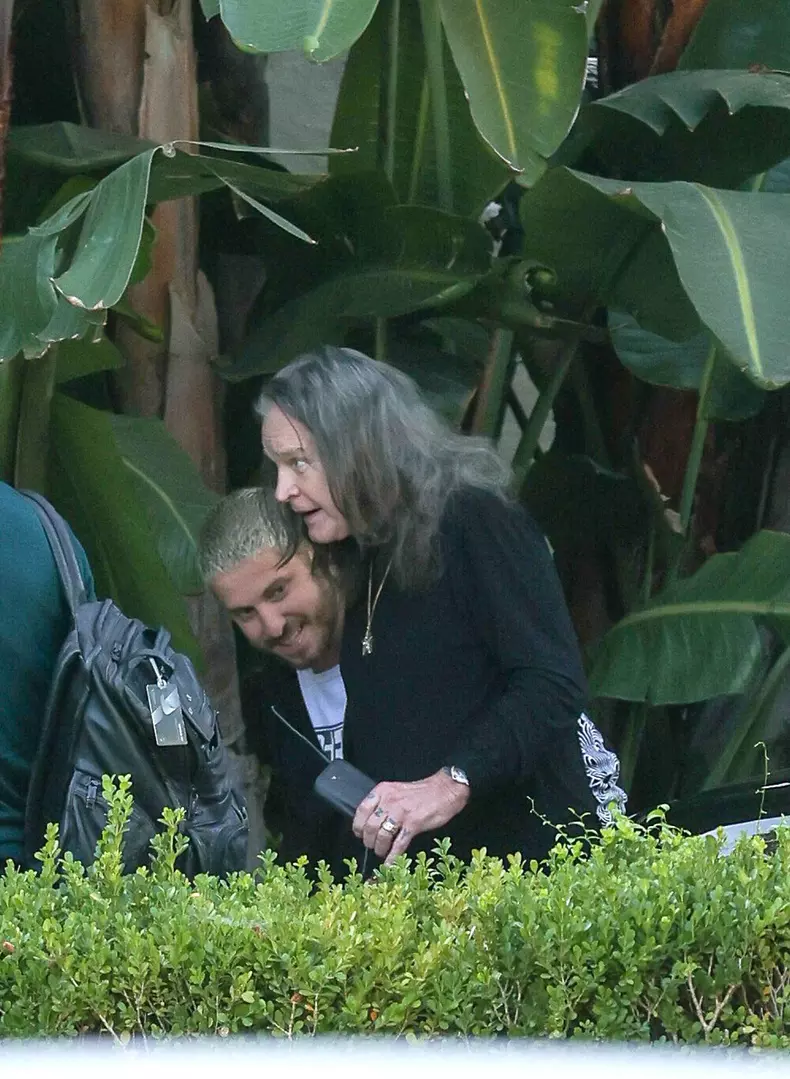 EXCLUSIVE: Ozzy Osbourne Receives A Warm Hug From Red Hot Chilli Peppers Drummer Chad Smith As They Meet Up Before Returning Home To Find Detectives Amid LA Crime Wave.