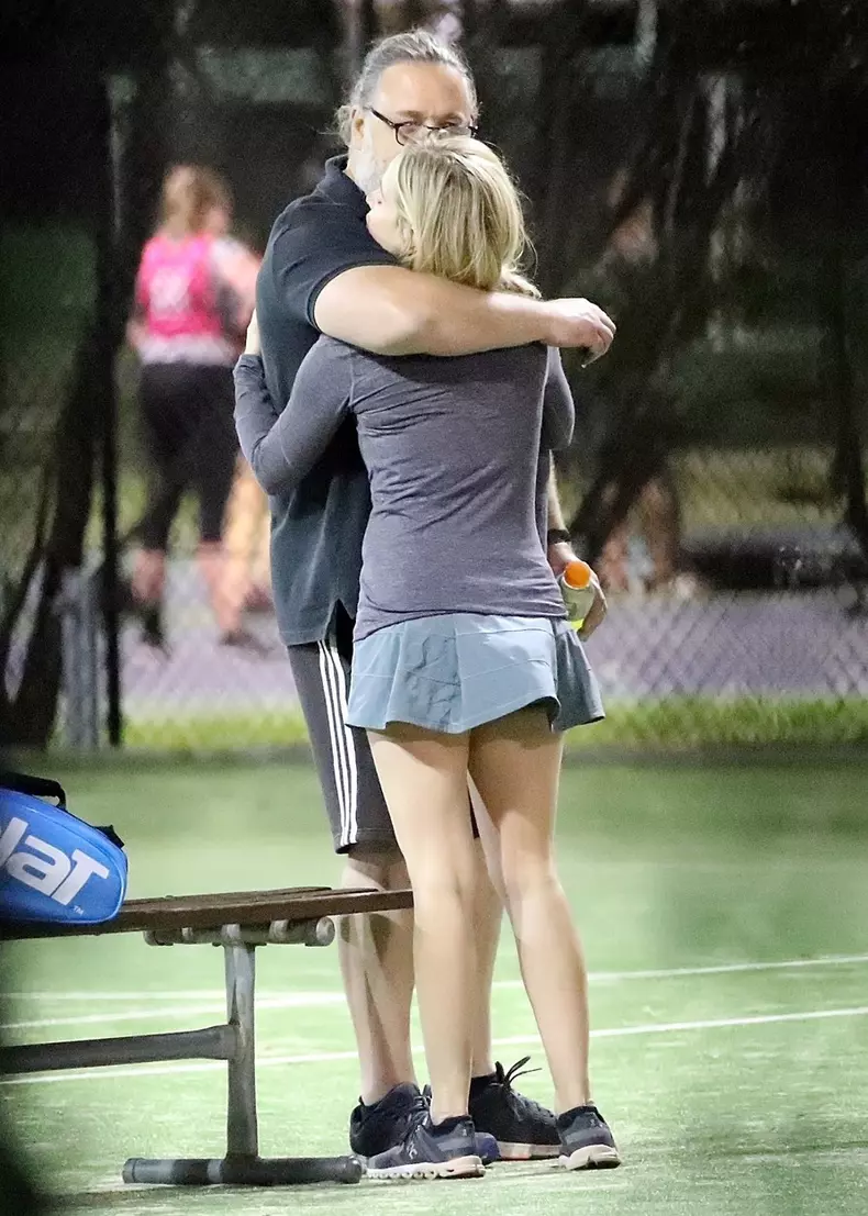 *EXCLUSIVE* Russell Crowe gets cozy with a younger woman while spending time at the tennis courts in Sydney!