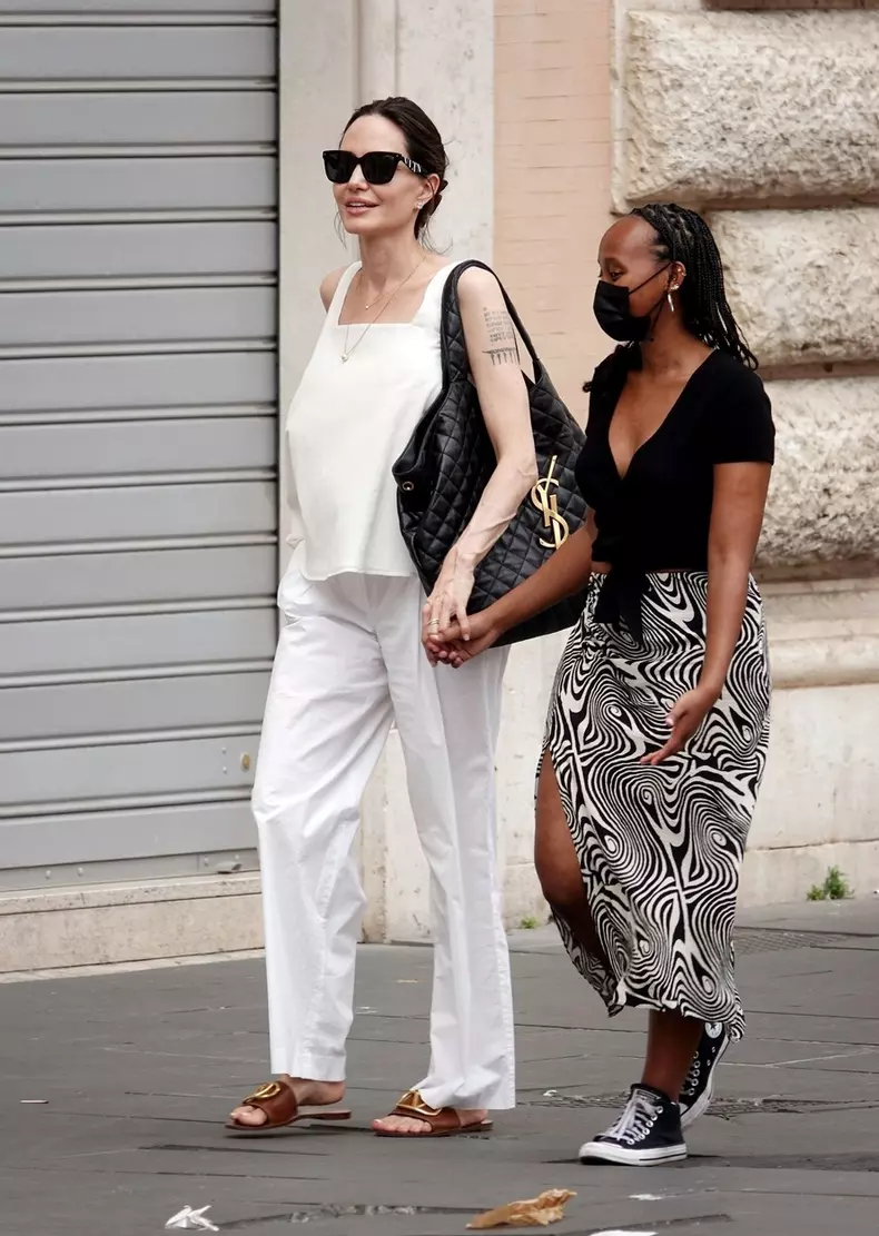 *EXCLUSIVE* WEB MUST CALL FOR PRICING  - American actress Angelina Jolie looks in great spirits as she treats her daughter Zahara to some shopping at Zara in Rome.