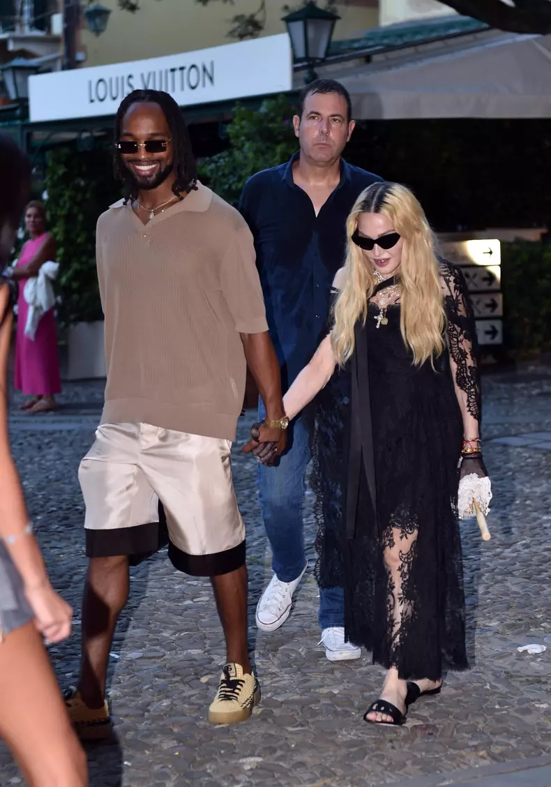 Madonna and her rumoured boyfriend Akeem Morris and a group of friends are pictured out and about in Portofino where they visited a church first before going for dinner at Punny restaurant.
Madonna was wearing a D&G outfit.