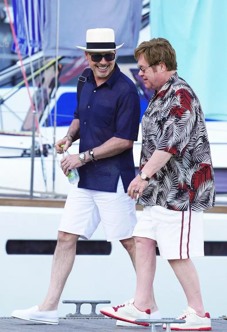 *EXCLUSIVE* *WEB MUST CALL FOR PRICING* Sir Elton John with his husband David Furnish continues to enjoy his family holiday in the South of France as the legendary British Singer chilled out on his boat with the Welsh Actor Taron Egerton who played Elton
