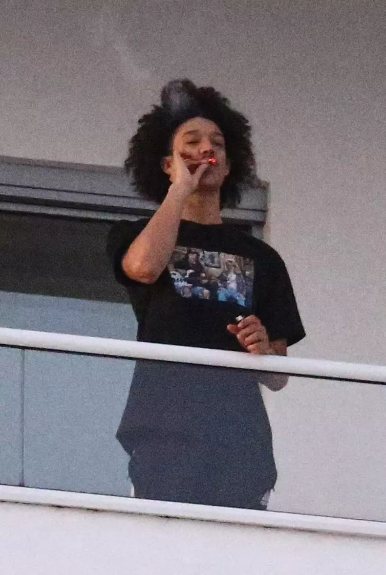 Madonna's new flame Ahlamalik Williams takes a smoke break with friends in Miami!