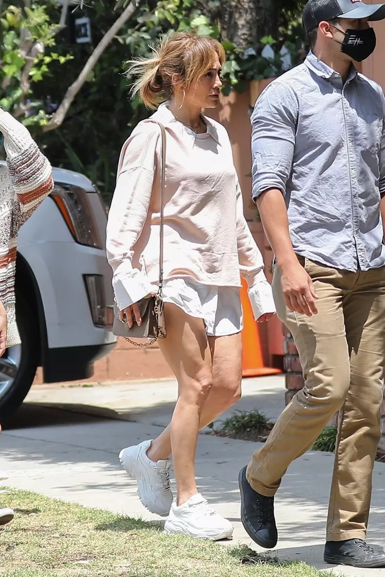 Jennifer Lopez shows off her legs while running errands with her twins
