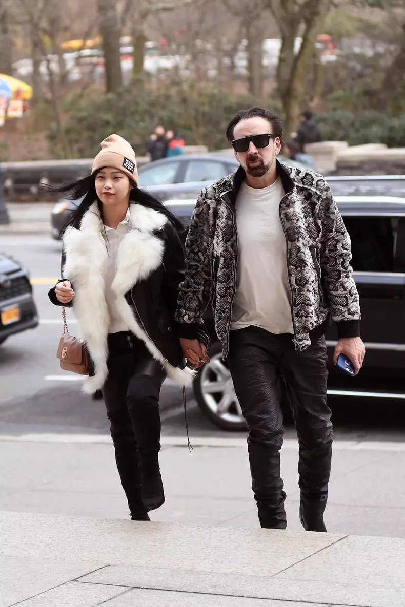 Nicolas Cage and his girlfriend matching black leather pants while going insid THE American Museum of Natural History