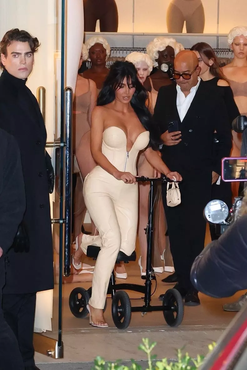 Kim Kardashian attends the SKIMS Flagship store opening with a Broken Foot in NYC