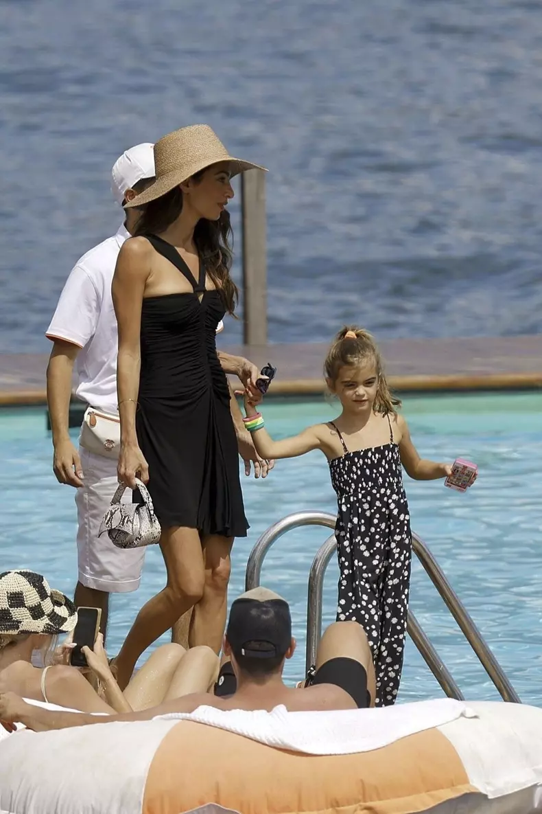 George Clooney and Amal Clooney, accompanied by their sleepy kids Ella and Alexander, embark on a picturesque boat trip in Como