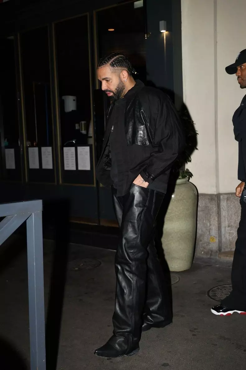 Drake leaves the Guisé restaurant after dinner in Paris