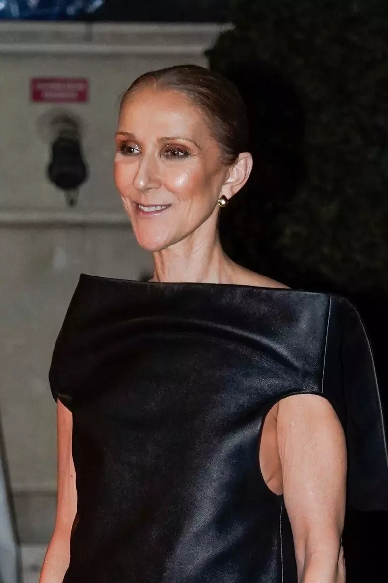 Celine Dion shares a moment with fans at her hotel in Paris
